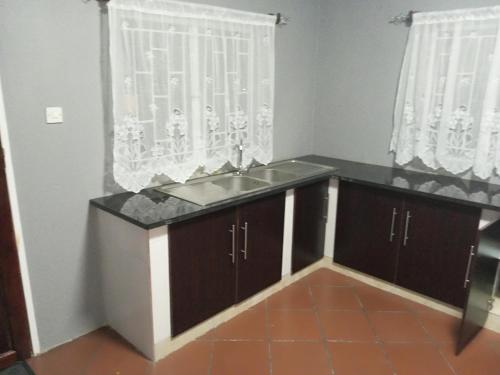 Dapur atau dapur kecil di Ramachi apartments