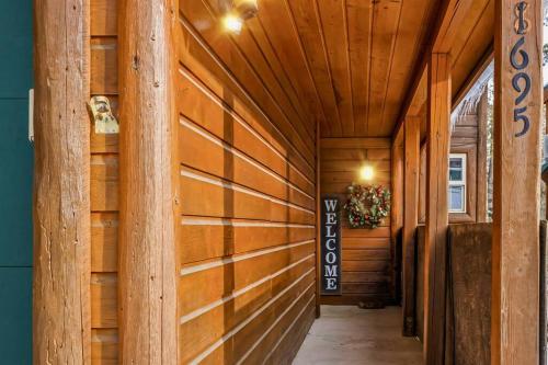 a hallway of a house with wooden walls at Ponderosa in McCall