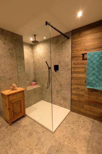 a shower with a glass door in a bathroom at Bergchalet Four Seasons in Reit im Winkl