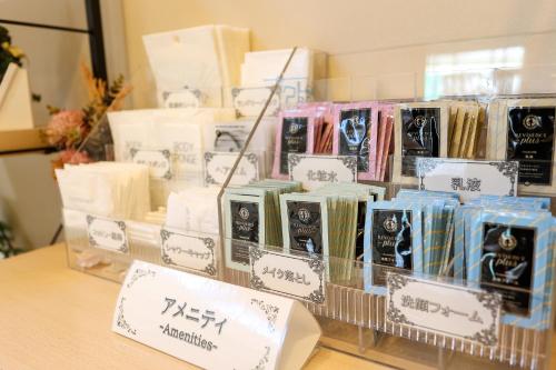 a display case with a bunch of soap on a table at Castle Inn Sendai in Sendai