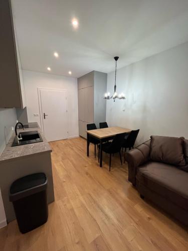 a living room with a couch and a table at ANETT Apartament nr 4 in Sulęcin