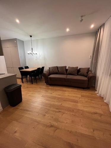 a living room with a couch and a table at ANETT Apartament nr 4 in Sulęcin