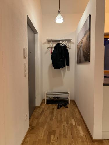 a room with a hallway with a door and a closet at Gamsfels Balbina Galeriewohnung in Langen bei Bregenz