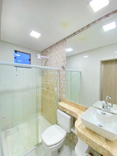 a bathroom with a toilet and a sink at Casa Vitória in Estância
