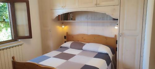 Ένα ή περισσότερα κρεβάτια σε δωμάτιο στο Casa Baggino
