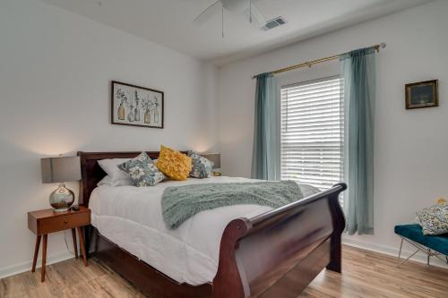 a bedroom with a bed and a window at Our Corner Cottage in Aiken