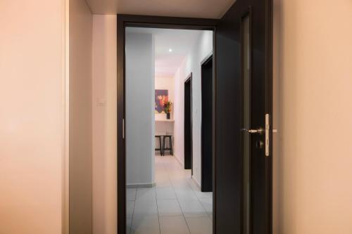 an open door leading to a hallway with a room at Apartmán Štefánik #1 in Martin