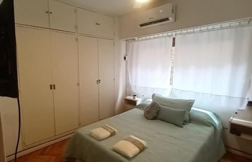En eller flere senger på et rom på Caballito Apartamen Premiun
