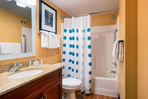 a bathroom with a sink and a toilet and a shower at TownePlace Suites Milpitas Silicon Valley in Milpitas
