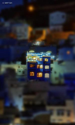 a blurry picture of a city at night at Casa Meftah Blue in Chefchaouene