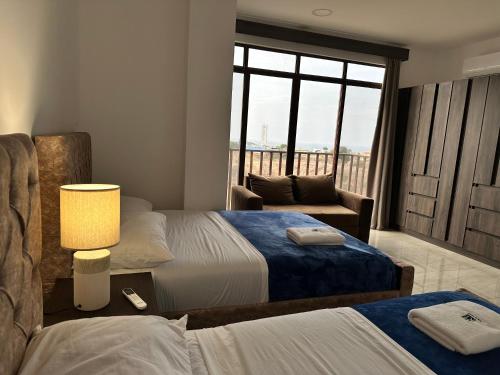 Una cama o camas en una habitación de Katamar