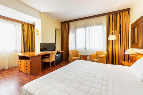 Una cama o camas en una habitación de Residence Villa Azzurra