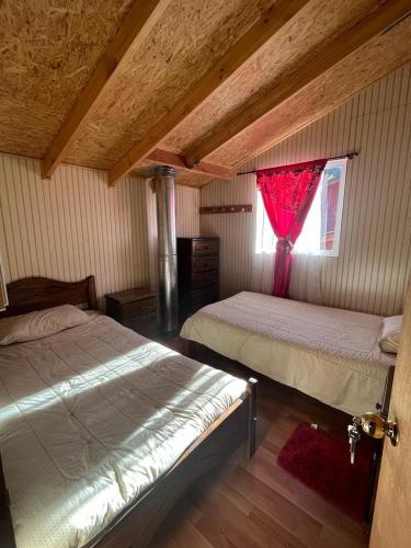 Llit o llits en una habitació de cabaña norma cerro castillo