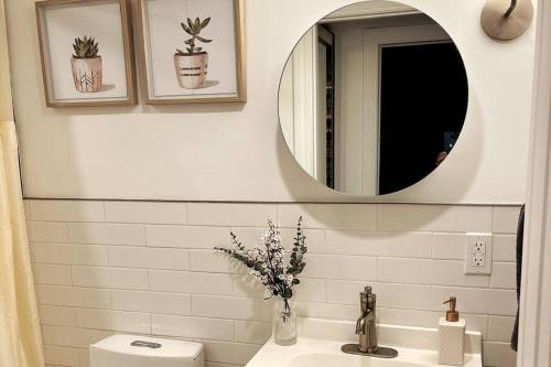 a bathroom with a sink and a mirror at Cozy NYC Apt, Carroll Gardens - long & short-term in Brooklyn