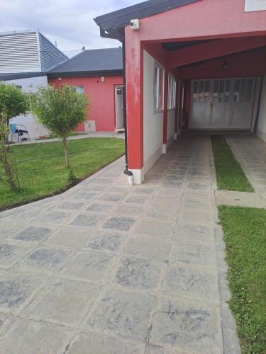 a brick walkway leading to a building at Vientos del Sur in Río Gallegos