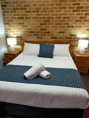 Ένα ή περισσότερα κρεβάτια σε δωμάτιο στο Bayview Motel