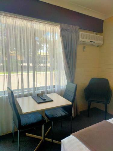 Ένα ή περισσότερα κρεβάτια σε δωμάτιο στο Bayview Motel