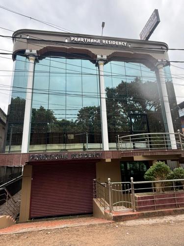 a building with a sign on top of it at PRARTHANA RESIDENCY in Attingal