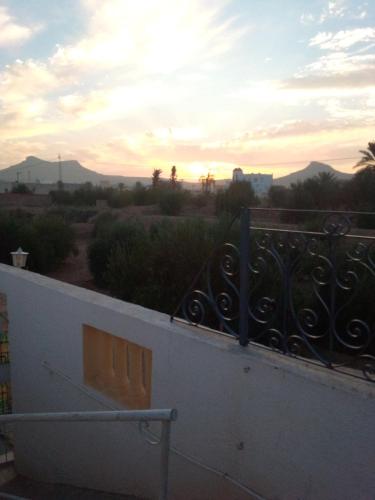 a view of the sunset from a balcony at Elmoubaraka in Tataouine
