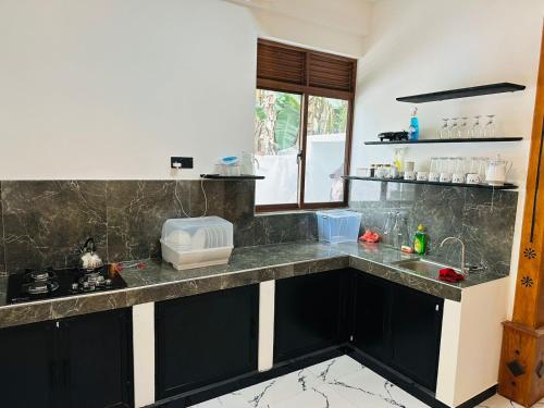 Η κουζίνα ή μικρή κουζίνα στο Beach heaven villa
