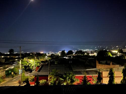 a view of a city at night at Room503SanSalvador in San Salvador