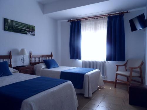 Hostal La Noriaにあるベッド
