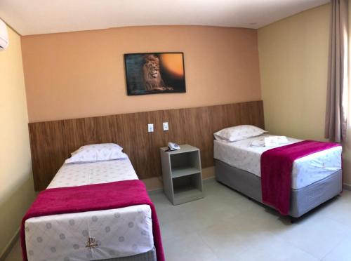 Ένα ή περισσότερα κρεβάτια σε δωμάτιο στο Premium Hotel