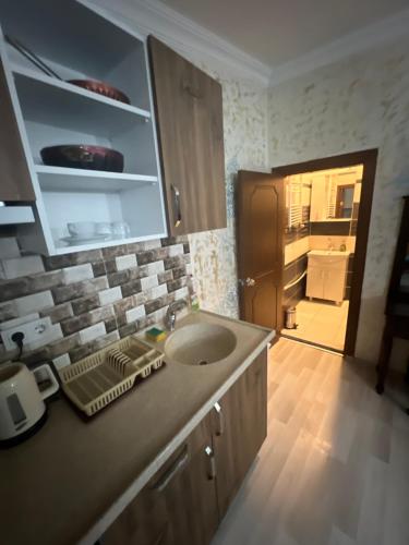 a bathroom with a sink and a counter top at İstiklal hostel istanbul in Istanbul