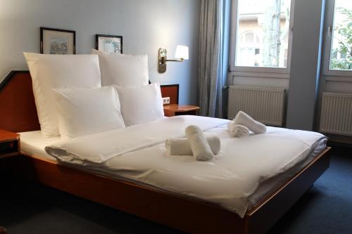 Ένα ή περισσότερα κρεβάτια σε δωμάτιο στο Hotel Mozart Bonn