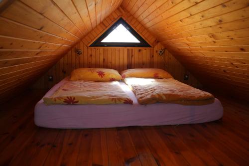 A bed or beds in a room at Apartment Příbram