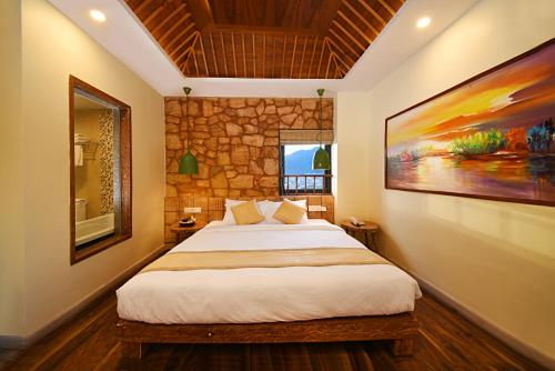 Ein Bett oder Betten in einem Zimmer der Unterkunft Woodapple Hotel and Spa