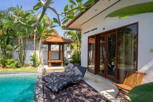 a villa with a pool and a gazebo at Villa Madalena 4BR Family Villa w Pool Walk to best Beach & Cafe in Canggu