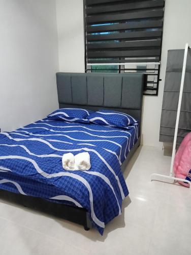 Postel nebo postele na pokoji v ubytování Amaryu homestay