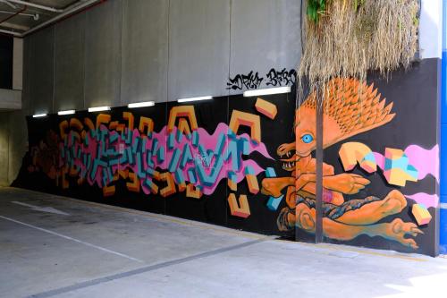 a wall with graffiti on it in a parking garage at CBD Japanese Retreat 2BR 1P Brekky Wifi Netflix in Canberra
