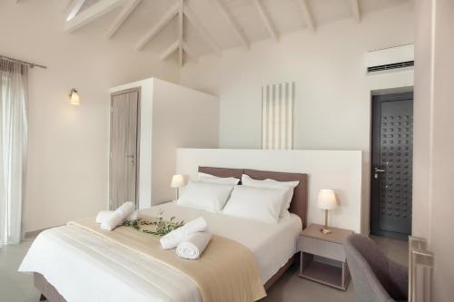 Ένα ή περισσότερα κρεβάτια σε δωμάτιο στο Petra Thea 
