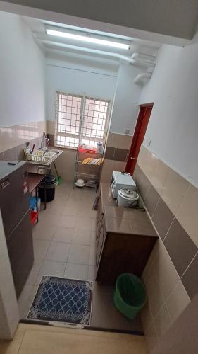 a kitchen with a sink and a counter in a room at 1201 Apartment Ladang Tok Pelam TepiPantaiBatuBuruk in Kuala Terengganu