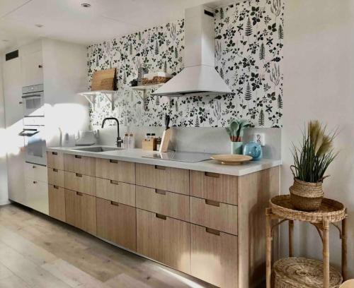 a kitchen with a sink and a counter at Nybyggt boende nära hav och natur. in Störlinge