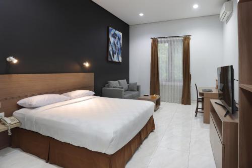 Televisyen dan/atau pusat hiburan di Jambuluwuk Residence Pakubuwono