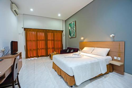 Katil atau katil-katil dalam bilik di Jambuluwuk Residence Pakubuwono