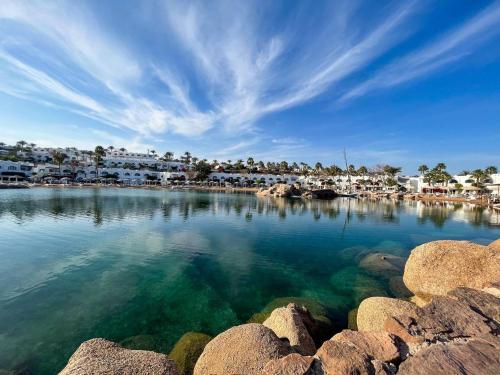 a large body of water with houses and condos at Elisir SPA & Hotel at Sheikh coast in Sharm El Sheikh