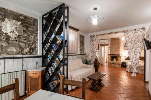 a living room with a couch and a fireplace at Il Torrione in Castiglione del Lago