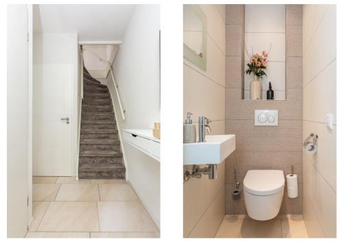 een badkamer met een wastafel, een toilet en een trap bij Holiday Home 't Groene Hart in Alphen aan den Rijn