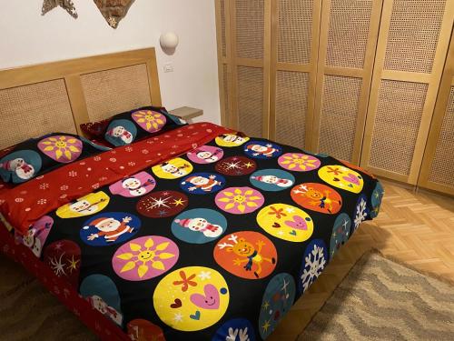a bed with a hello kitty comforter in a bedroom at Sweet cozy Ultracentral in Craiova