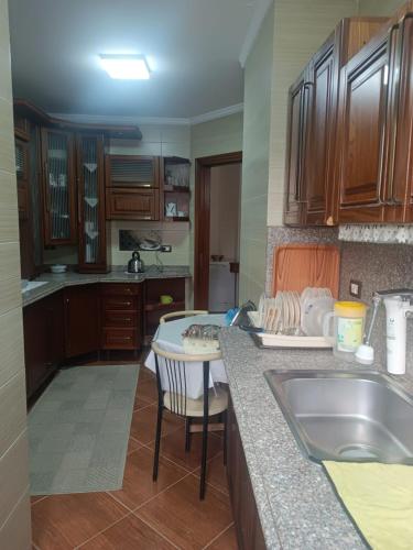 a kitchen with a sink and a counter top at Luxury apartment in laurent in Alexandria