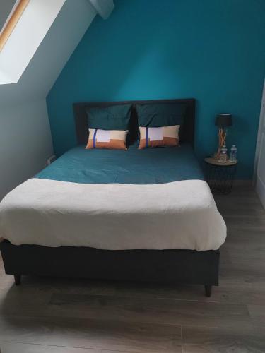 Кровать или кровати в номере Chambre d'hôtes Orchidée