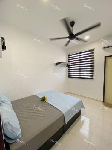 Ένα ή περισσότερα κρεβάτια σε δωμάτιο στο SmartChoice Homestay