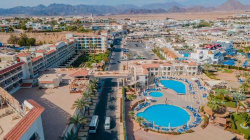 an aerial view of a resort with two pools at Marina Sharm Hotel in Sharm El Sheikh