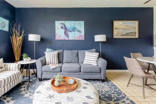 a living room with a couch and a table at Carey Beach Villa in Humacao