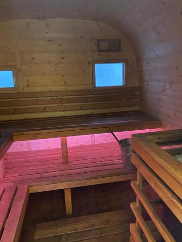 an inside view of a sauna with two windows at Silumetras in Ventspils