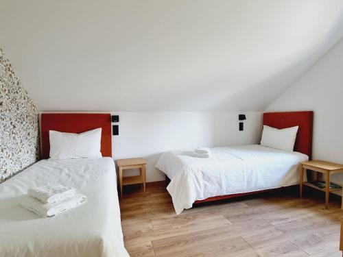 Voodi või voodid majutusasutuse Gîte Le Chambougeal avec spa privatif toas